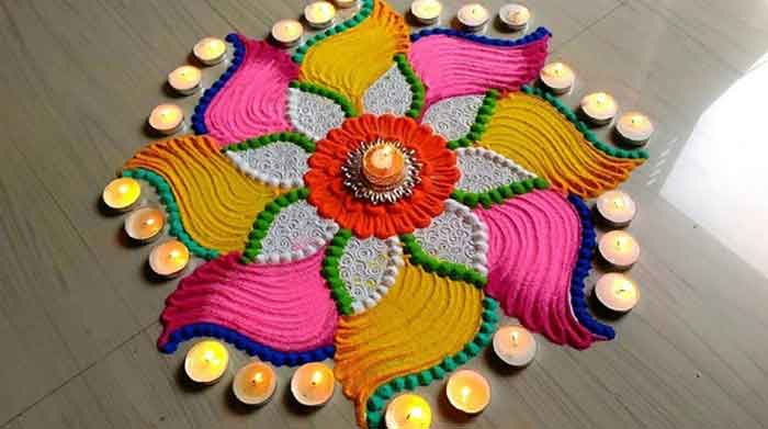 floral rangoli with diyas