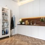 Angle,View,Of,Modern,Interior,With,White,Kitchen,Cupboards,,Kitchenware