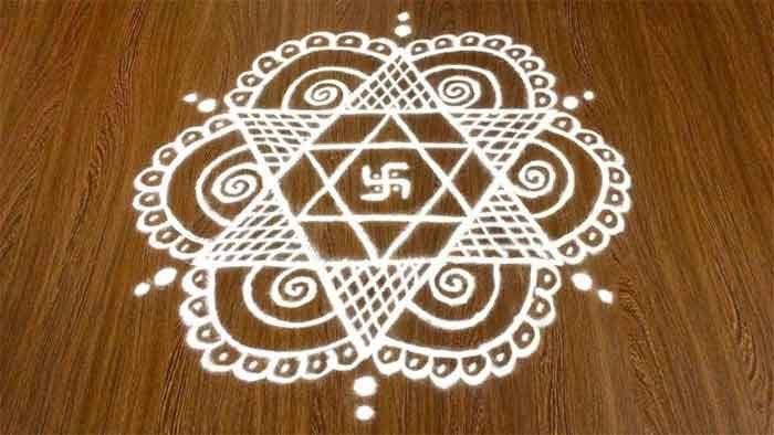 swastik rangoli with dots design