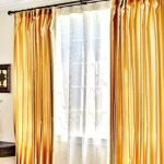 Golden Curtains On A White Wall