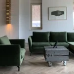 Green Sofa with Wooden Flooring